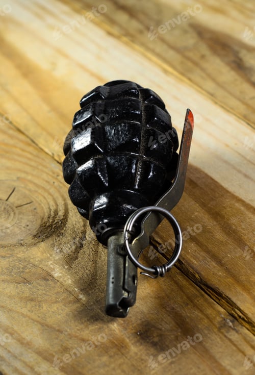 Preview: Black Hand Grenade On The Wooden Table