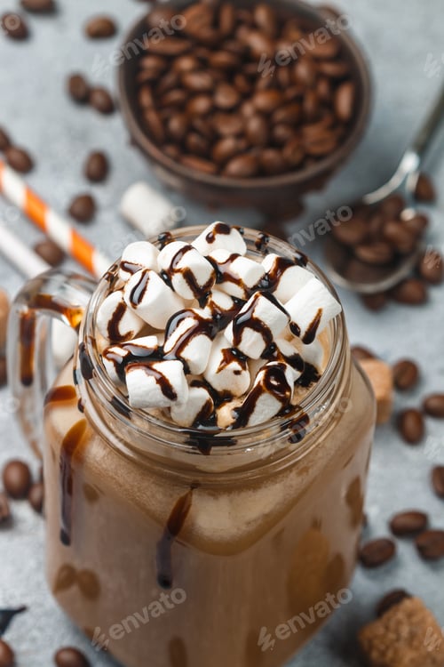 Preview: Chocolate Frappe Coffee With Marshmallows And Syrup In A Mason Jar . Selective Focus