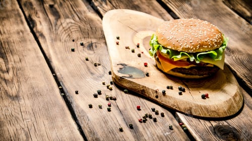 Preview: Fresh Burger With Cheese, Meat And Vegetables. On Wooden Background.