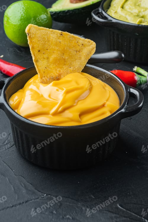 Preview: Creamy Cheddar Sauce With Chia Seeds In Bowl, On Black Background