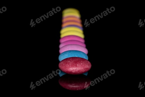 Preview: Lot Of Whole Sweet Colourful Candy Isolated On Black Glass