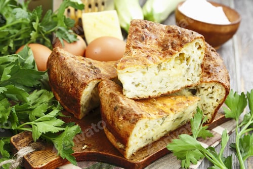 Preview: Pie With Zucchini, Cheese And Herbs On The Table
