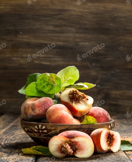 Preview: Fresh Peaches In A Bowl. On A Wooden Background.