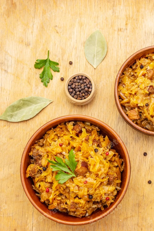 Preview: Stewed (Braised) Cabbage Served On Ethnic Ceramic Bowl. Traditional Polish Bigos With Meat
