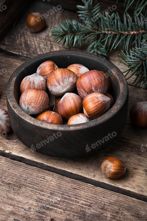 Preview: Hazelnut In Wooden Bowl On A Retro Background