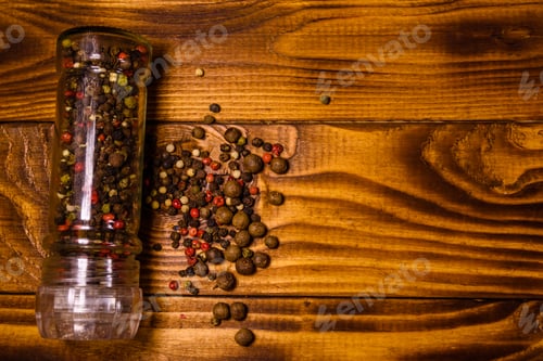 Preview: Pepper Mill And Scattered Spices On Rustic Wooden Table. Top View