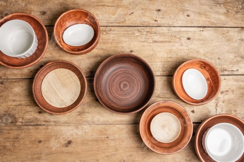 Preview: Handmade Empty Ceramic Dishes And Plates On Wooden Background. Collections Of Various Bowls