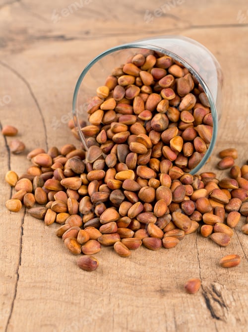 Preview: Pine Nuts On Wooden Surface