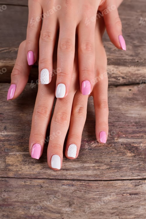 Preview: Pink and White Nail Art on Wooden Surface