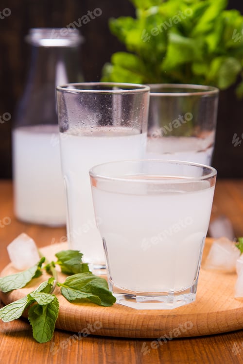 Preview: Fresh Soda Drink With Ice And Mint On Wooden Background