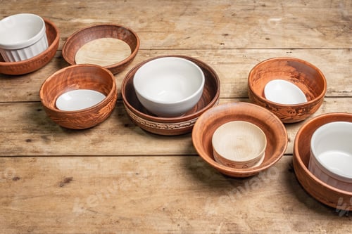 Preview: Handmade Empty Ceramic Dishes And Plates On Wooden Background. Collections Of Various Bowls