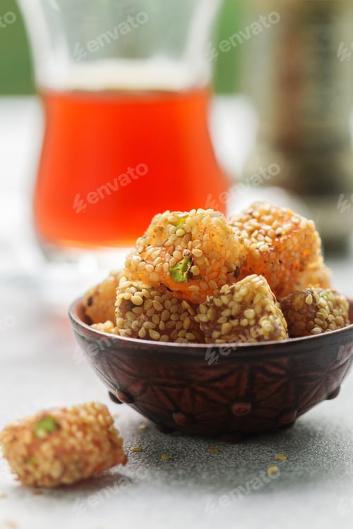 Preview: Traditional Turkish Delight. Lokum. Oriental Sweets With Sesame And Pistachios In A Ceramic Bowl On