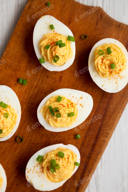 Preview: Homemade Deviled Eggs With Chives On A Rustic Wooden Board, Overhead View. Flat Lay, Top View, From