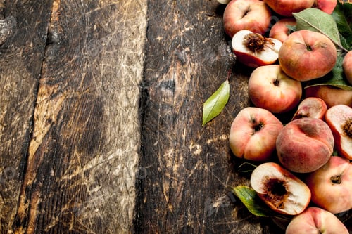 Preview: Fresh Peaches With Leaves. On A Wooden Background.
