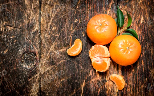 Preview: Fresh Tangerines With Green Leaves. On Wooden Background.