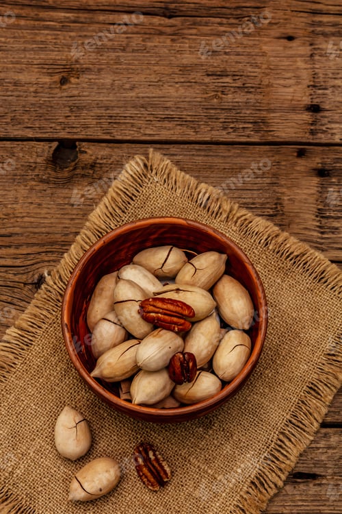 Preview: Ripe Pecan On Vintage Wooden Background. Traditional Ingredient For Pecan Pie In Usa