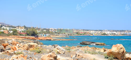 Preview: Rocks On The Shore Of The Sea And The City Of Hersonissos, Crete, Greece.