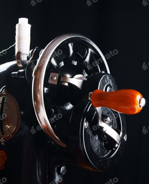 Preview: The Sewing Machine On Black Background.