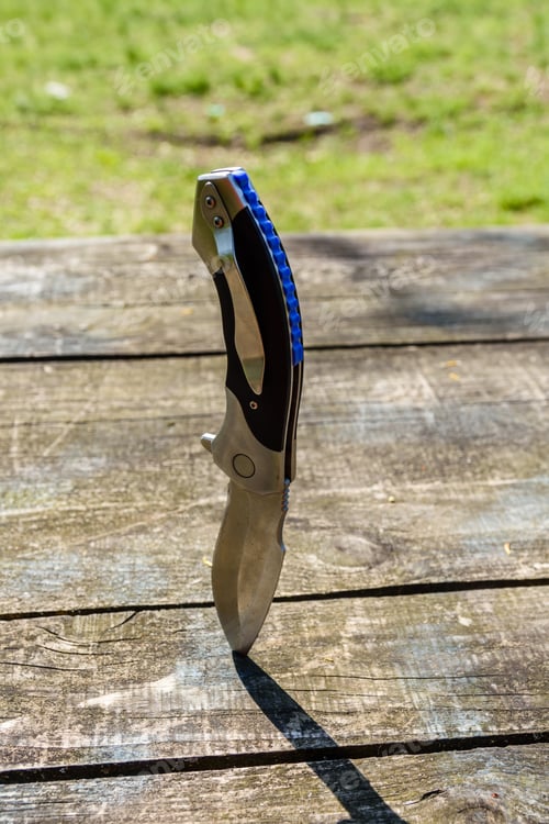Preview: Folding Knife Stuck In Old Wooden Board