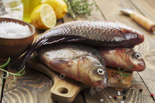 Preview: Fresh Fish Crucian On A Wooden Table