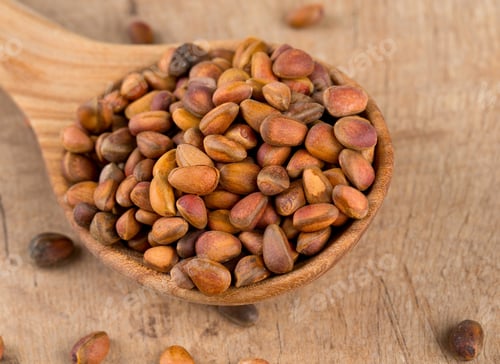 Preview: Pine Nuts On Wooden Surface