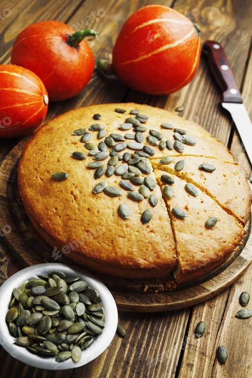 Preview: Pumpkin Cake With Seeds On A Wooden Table
