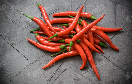 Preview: Red Hot Chili Pepper On Black Surface. Selective Focus
