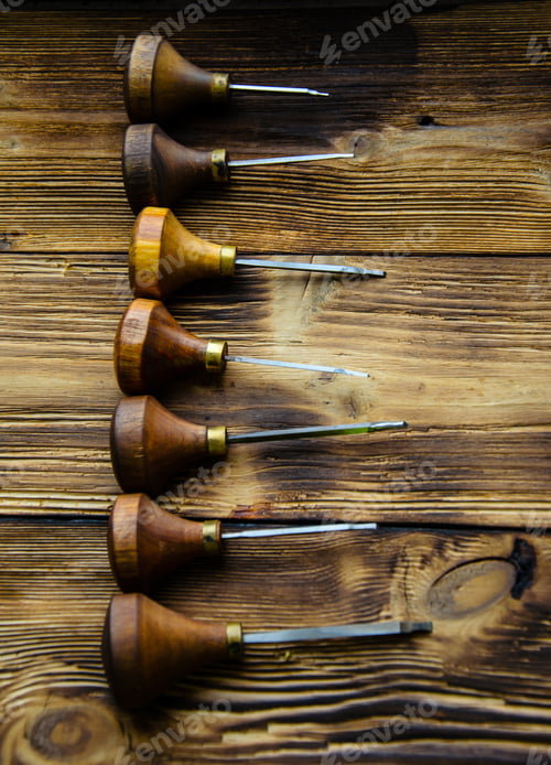 Preview: Different Gravers For Jewelry On A Wooden Background