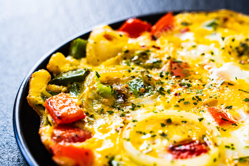 Preview: Breakfast - Scrambled Eggs With Vegetables On Black Stone Background