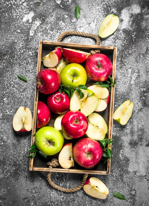 Preview: Red And Green Apples In A Wooden Tray. On A Rustic Background.