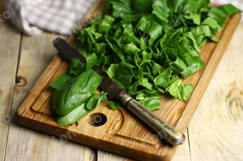 Preview: Sliced Spinach On A Wooden Cutting Board. Fresh Juicy Spinach For Cooking.