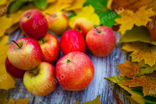 Preview: Apple With Leaves On A Wooden Background