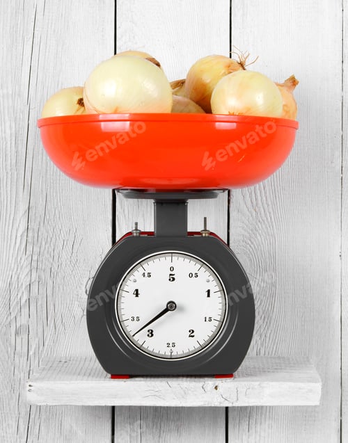 Preview: Onions On Scales On A Wooden Shelf.