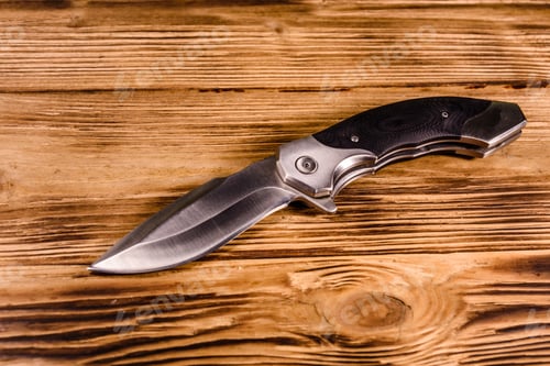 Preview: Opened Folding Knife On Rustic Wooden Table