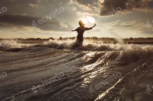 Preview: Young Woman On Sea Embracing The The World And The Waves