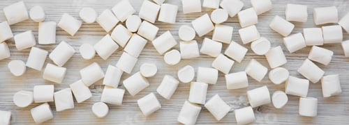 Preview: Sweet White Marshmallows On A White Wooden Table, Overhead View. Flat Lay, From Above, Top View