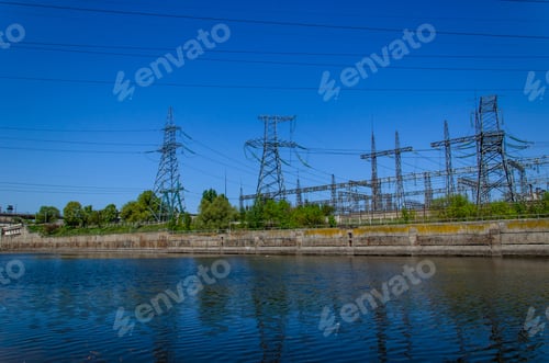 Preview: High Voltage Power Lines And Towers Against Blue Sky