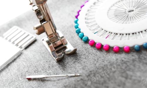 Preview: The Sewing Machine And Needles On A Fabric.