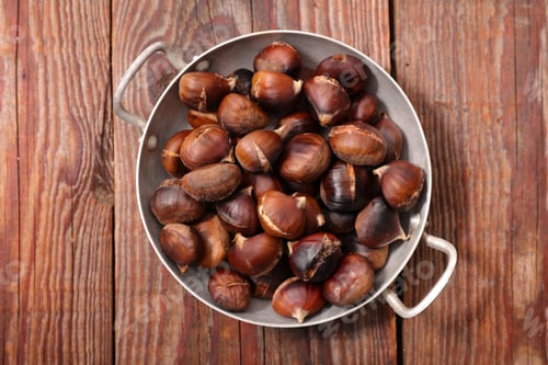 Preview: Roasted Chestnut On Wood Background