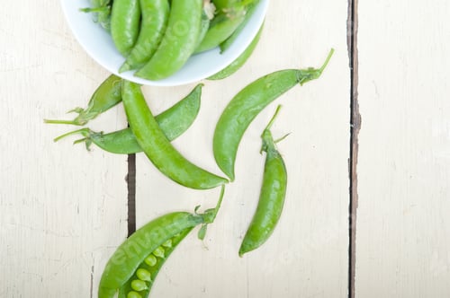 Preview: Hearthy Fresh Green Peas Over A Rustic Wood Table