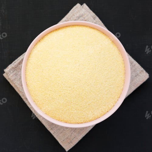 Preview: From Above, Dry Semolina Durum Flour In A Pink Bowl Over Black Surface, Top View. Overhead, From