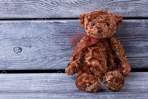 Preview: Cute Teddy Bear On Old Wood Background. Toy Bear. Gift On A Holiday.