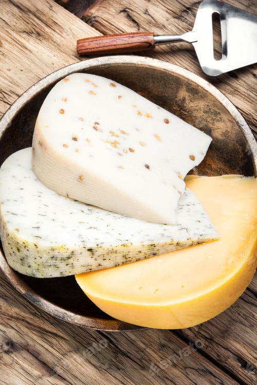 Preview: Different Types Of Cheese On Rustic Wooden Table
