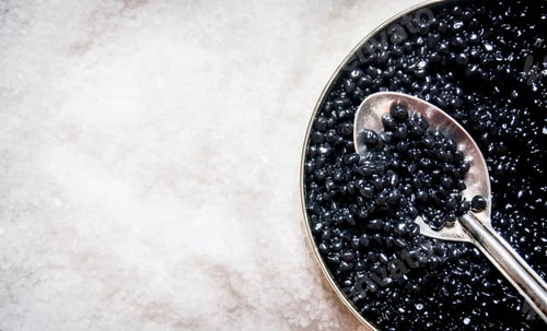Preview: Jar With Black Caviar And A Spoon Of Salt. Free Space For Text . Top View