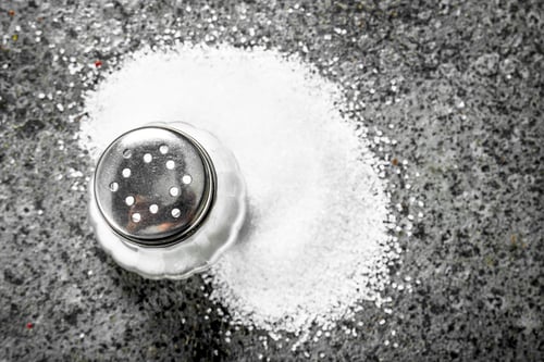 Preview: Salt In Glass. On Rustic Background