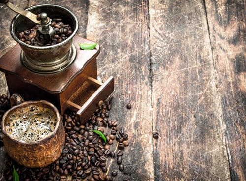 Preview: Fresh Coffee In A Clay Mug With An Old Coffee Grinder. On A Wooden Background.