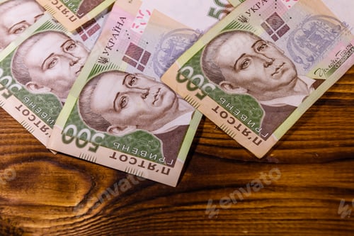 Preview: Ukrainian Five Hundred Hryvnas Banknotes On Rustic Wooden Table