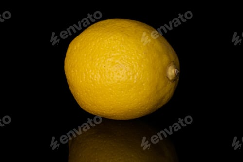 Preview: One Whole Fresh Yellow Lemon Isolated On Black Glass