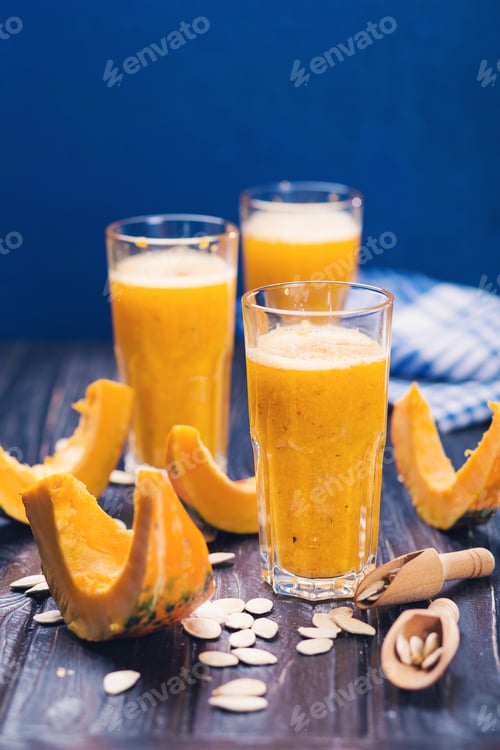 Preview: Delicious Pumpkin Smoothie With Seeds In Studio On Wooden Background