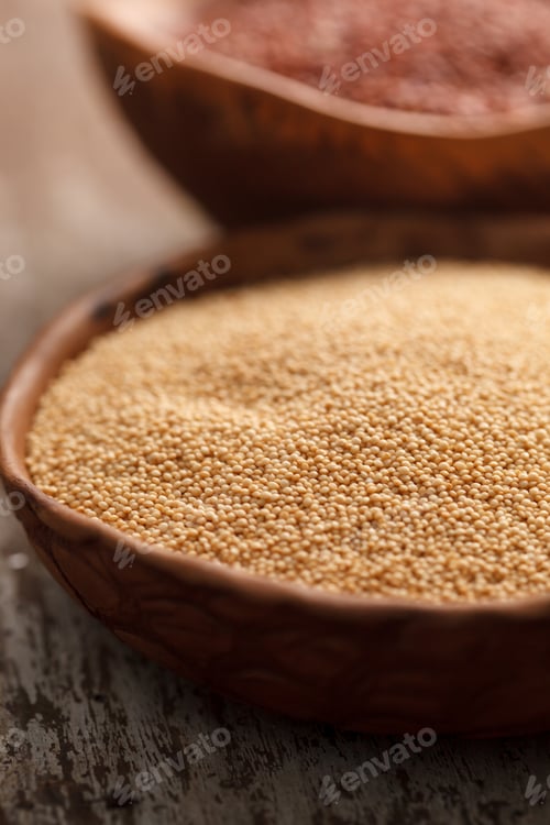 Preview: Wooden Bowls Full of Grain on Rustic Surface